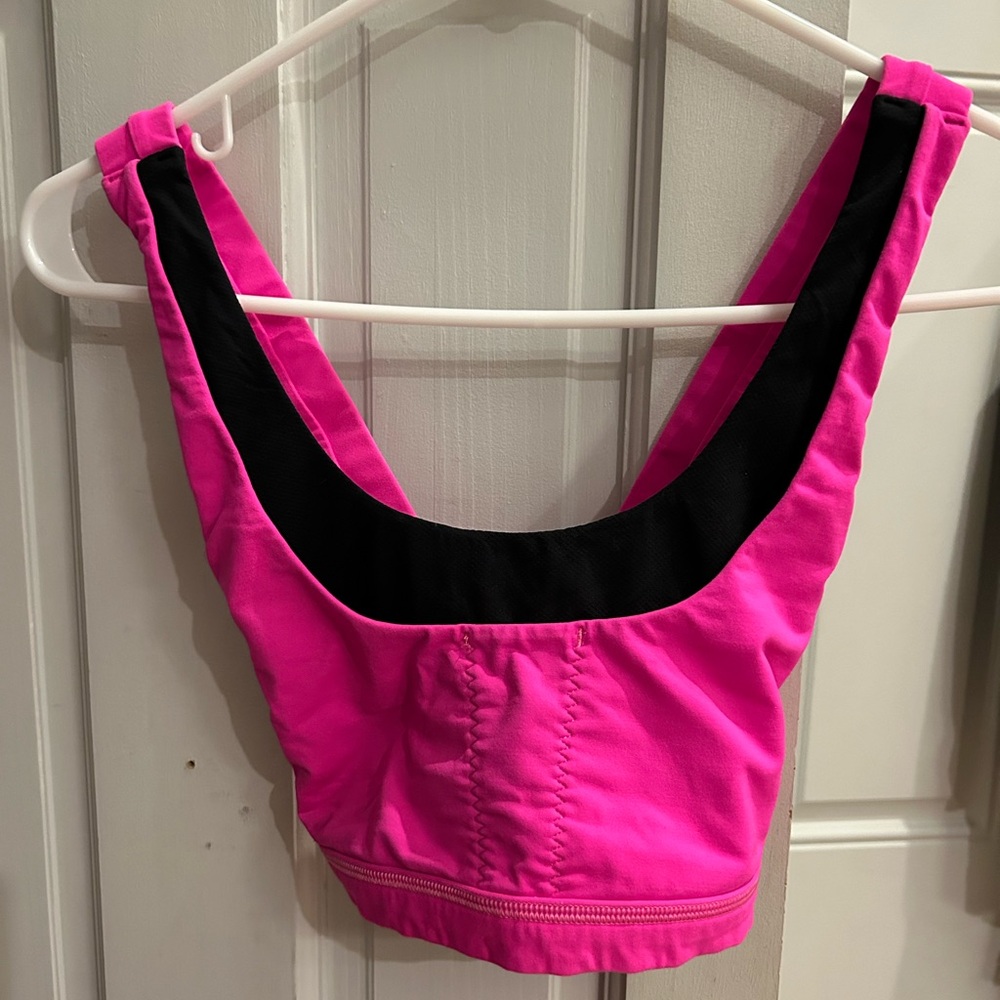 Pink Lululemon crossed back sports bra. Size 4.
